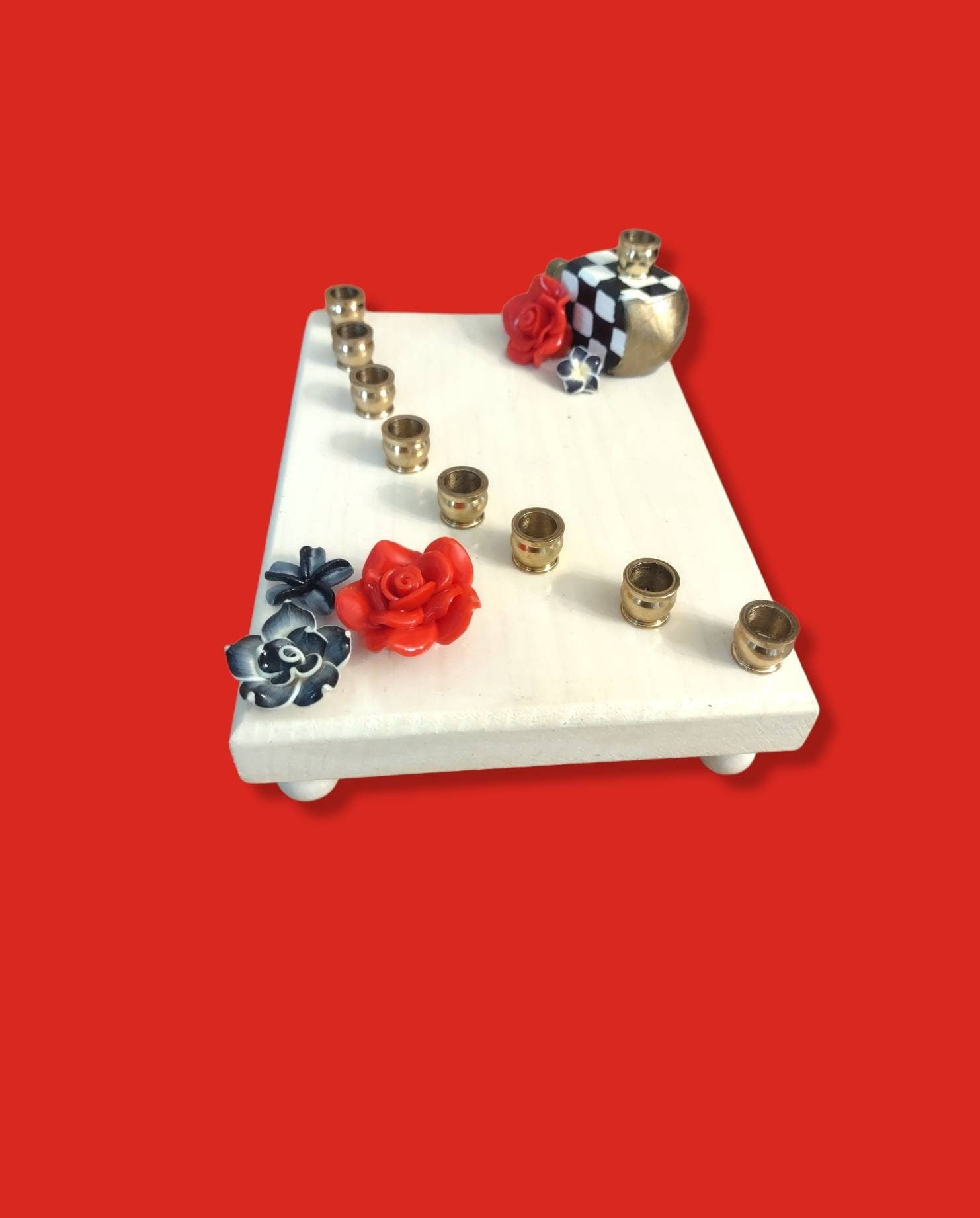 Checkerboard flower menorah — painted checks with red silicone blooms and brass cups | Judaica Square Lakewood (view 2)