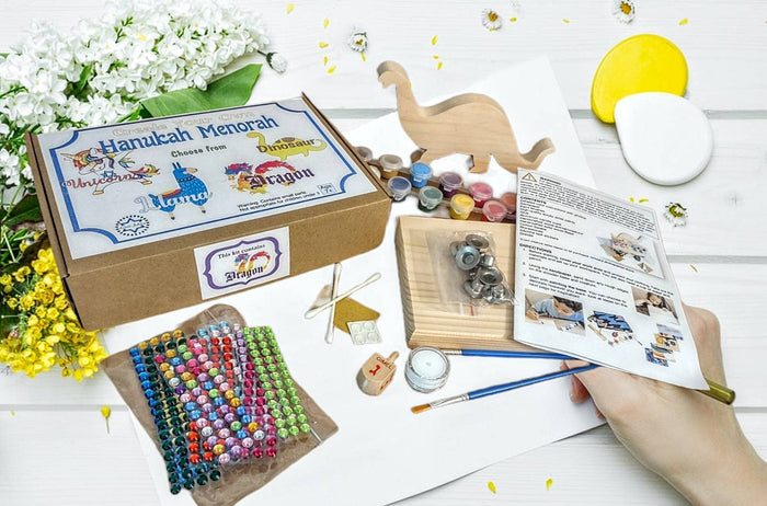 Dinosaur menorah craft kit — wooden Menorasaurus pieces with paint and decorative materials | Judaica Square Lakewood