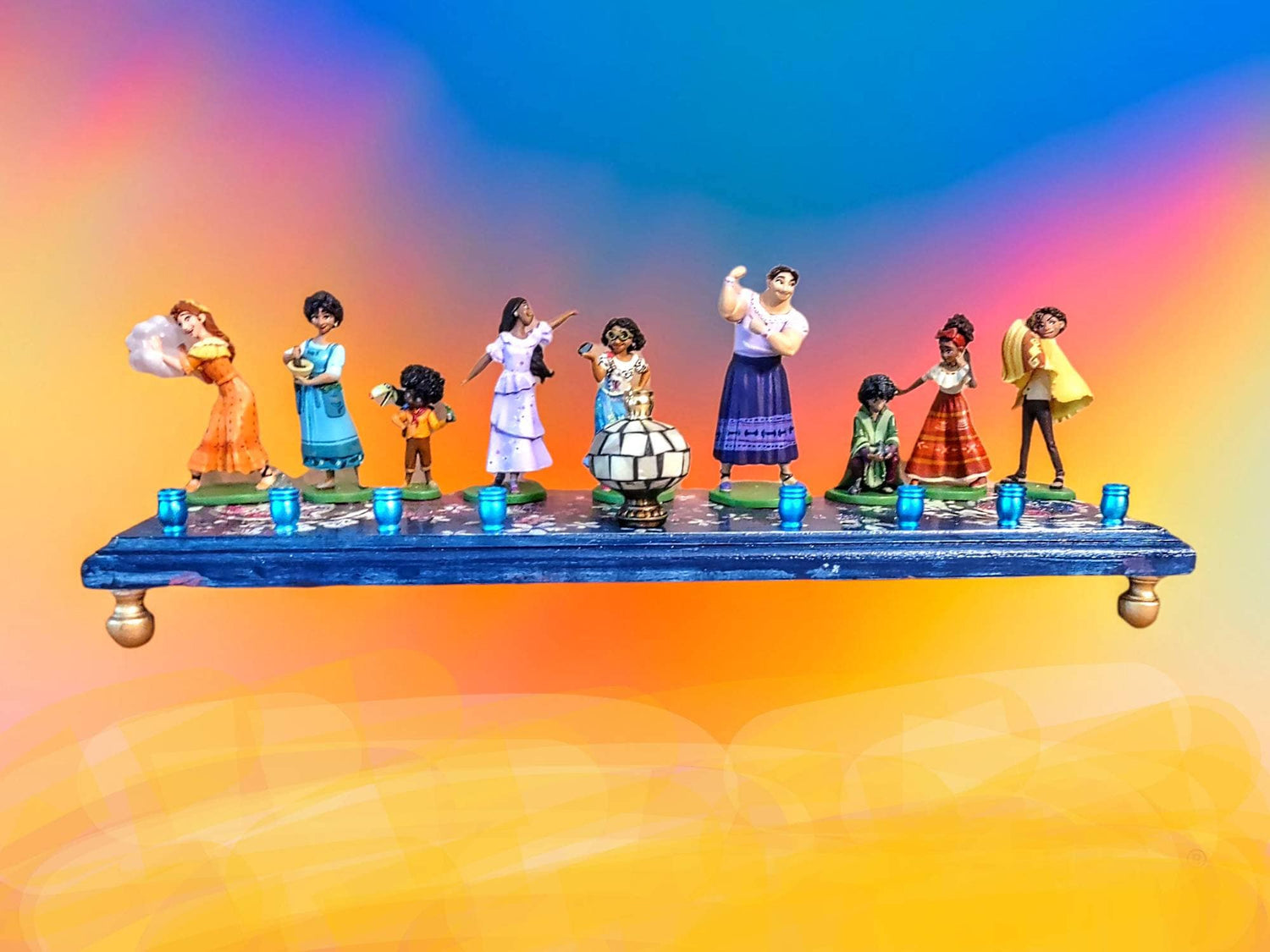 Encanto menorah — repurposed Disney figurines with glitter paint on a choice of base | Judaica Square Lakewood (view 2)
