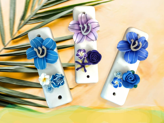 Ceramic tropical flower mezuzah case — slim glazed case with silicone bloom and metal trim | Judaica Square Lakewood
