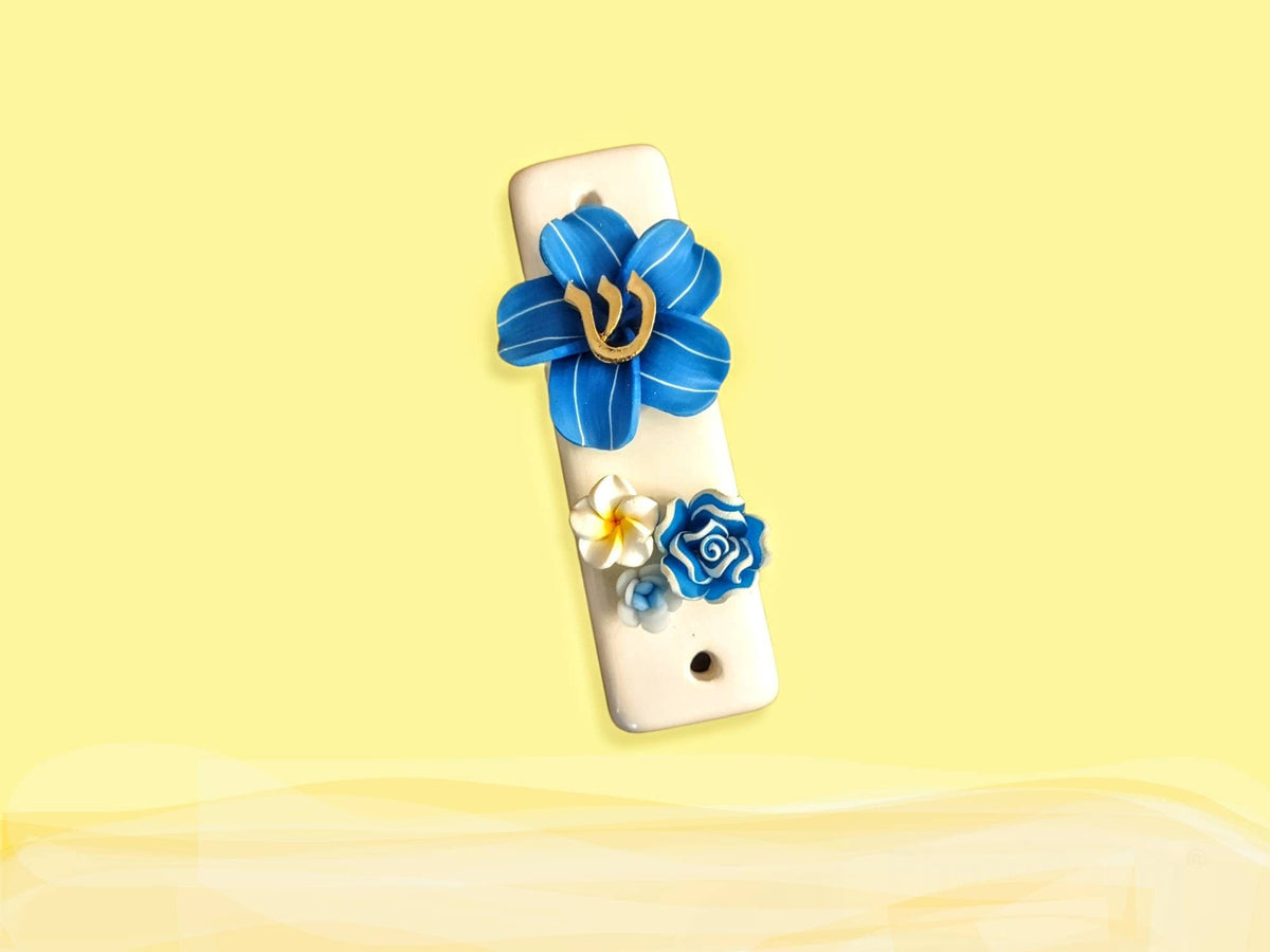 Ceramic tropical flower mezuzah case — slim glazed case with silicone bloom and metal trim | Judaica Square Lakewood (view 3)