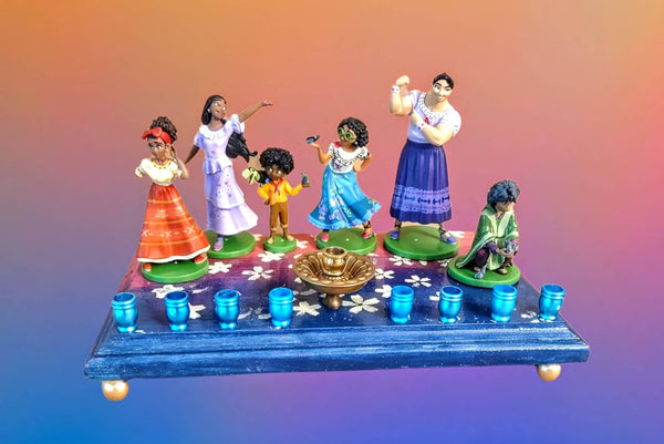Encanto collector menorah — glittered Disney figures around a vintage door knob shamash | Judaica Square Lakewood
