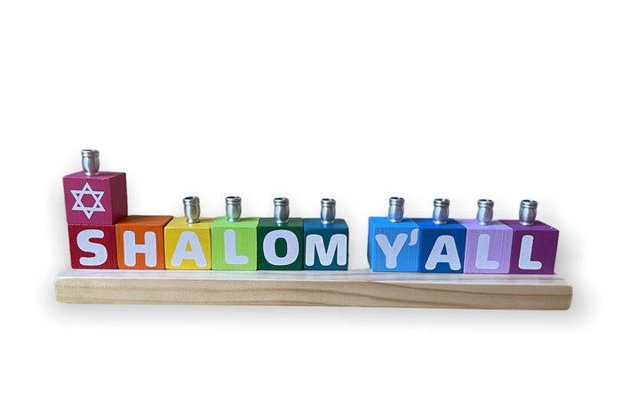 Shalom Y'all Menorah — rainbow painted wood letters with aluminum candle cups | Judaica Square Lakewood
