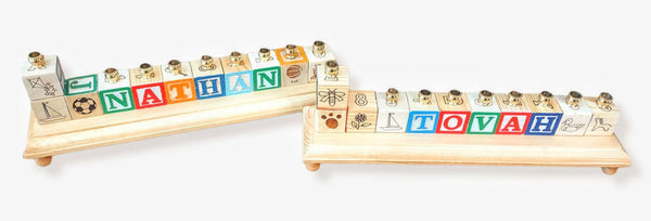 Personalized name menorah — repurposed wooden alphabet blocks on stained base with brass cups | Judaica Square Lakewood