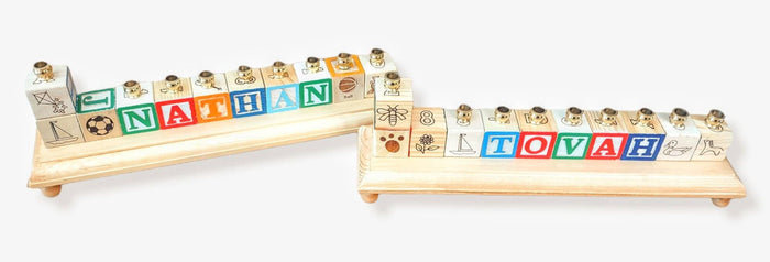 Personalized name menorah — repurposed wooden alphabet blocks on stained base with brass cups | Judaica Square Lakewood
