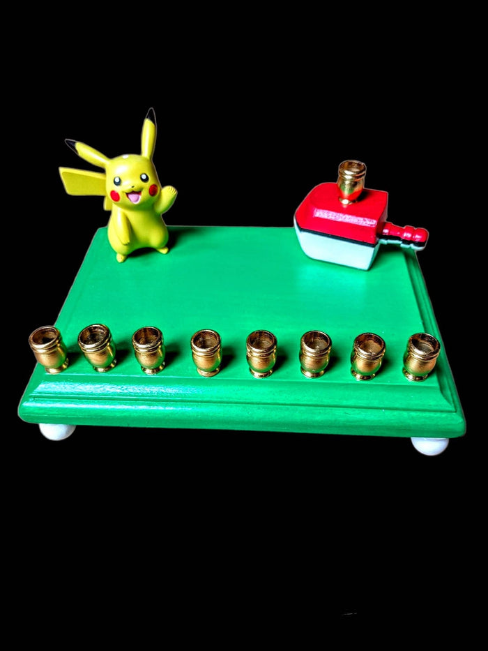 Pikachu Pokemon menorah — licensed resin figure with gold aluminum candle cups | Judaica Square Lakewood