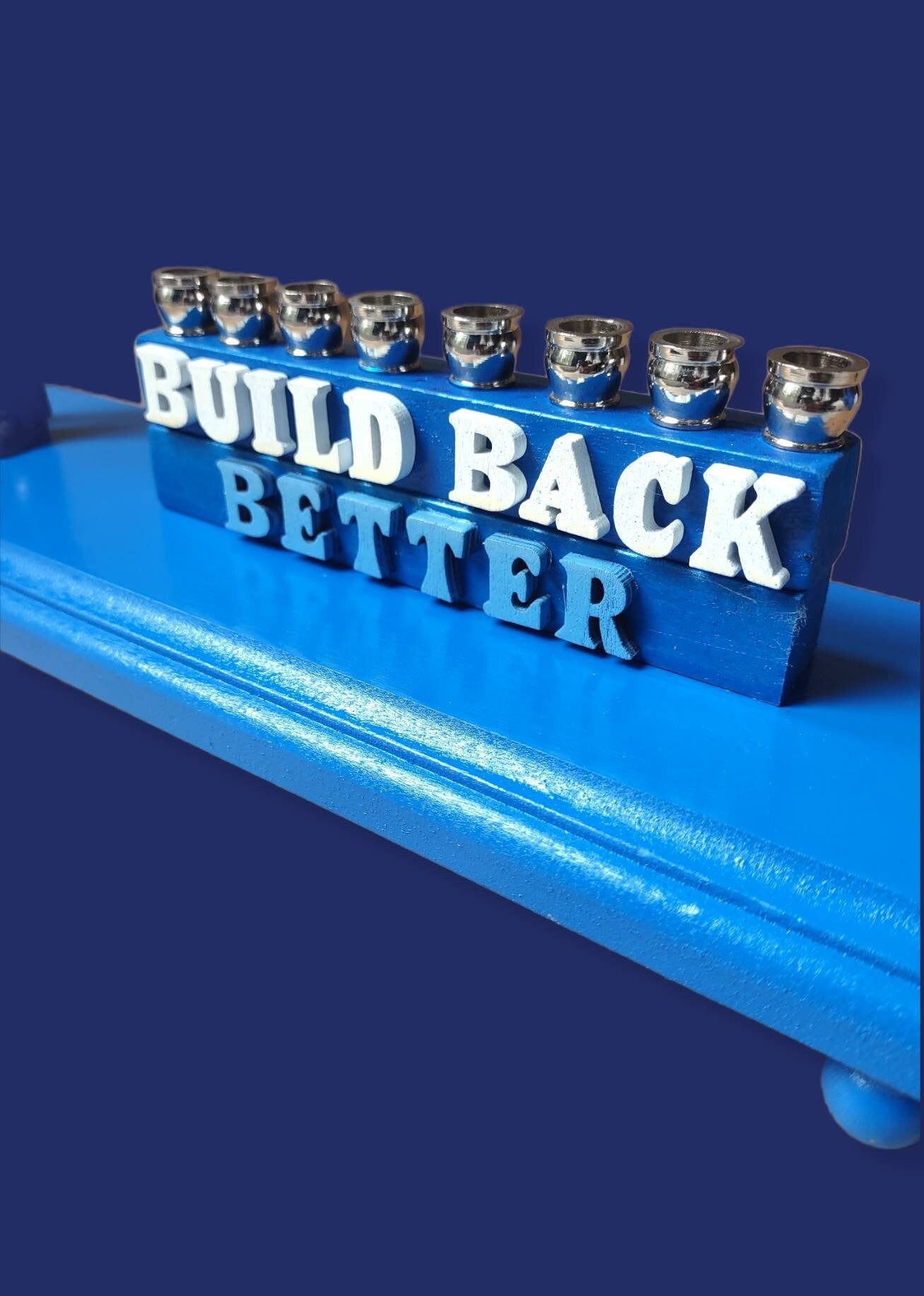 Joe Biden menorah — action figure with Build Back Better wood letters and nickel cups | Judaica Square Lakewood (view 2)