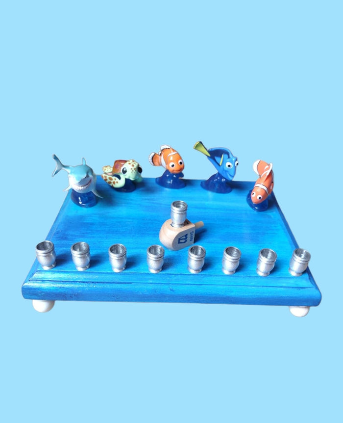 Finding Nemo Menorah — clownfish and blue tang figures on a painted plaque | Judaica Square Lakewood