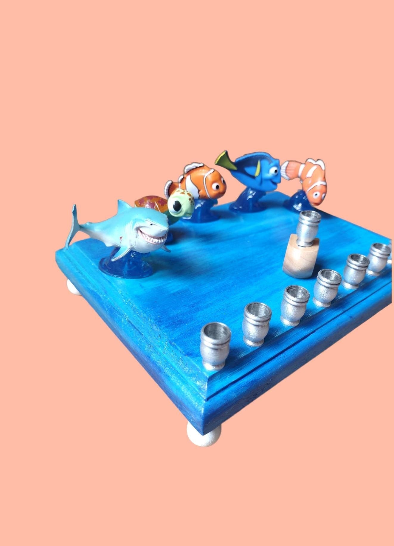 Finding Nemo Menorah — clownfish and blue tang figures on a painted plaque | Judaica Square Lakewood (view 4)
