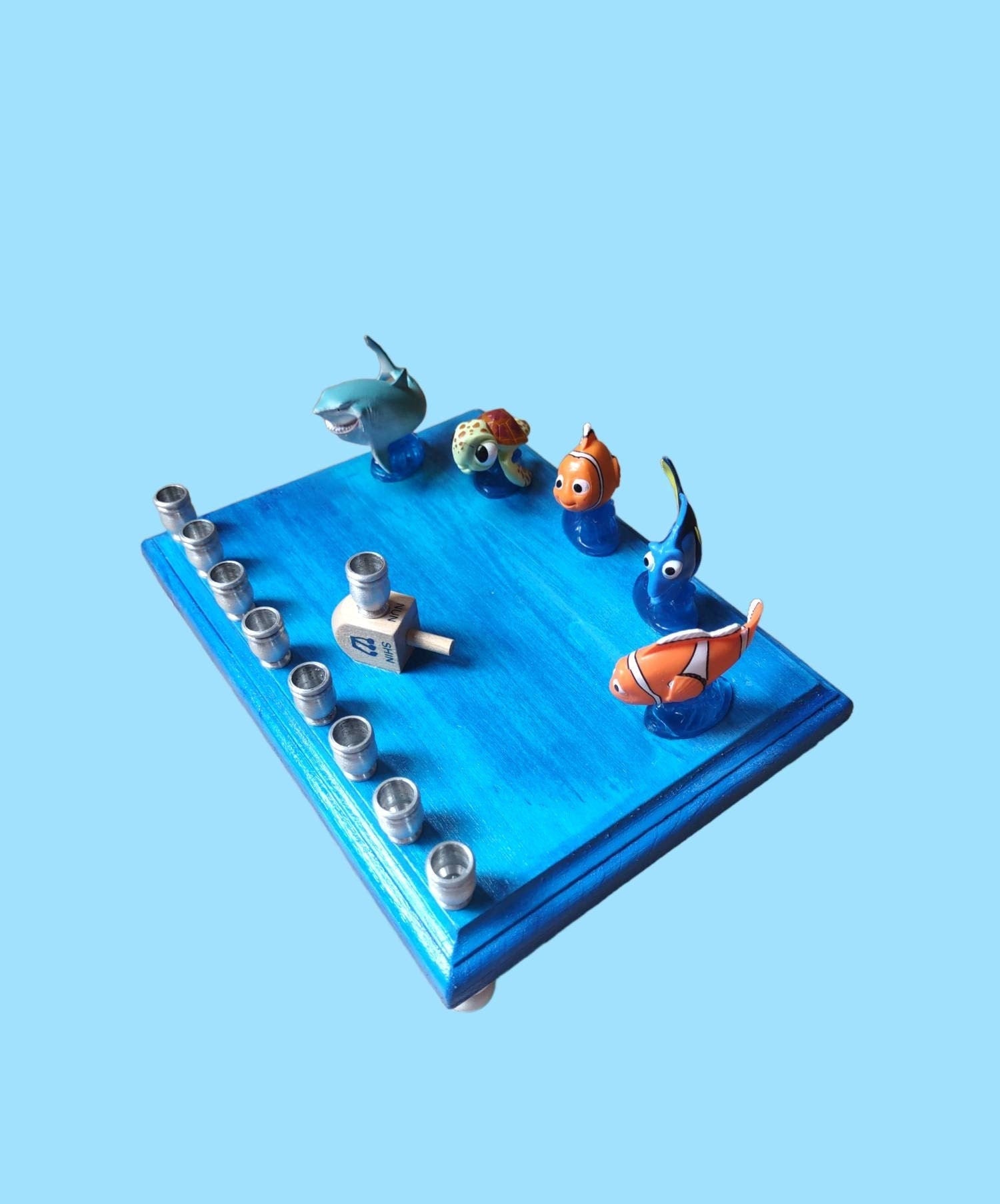 Finding Nemo Menorah — clownfish and blue tang figures on a painted plaque | Judaica Square Lakewood (view 5)