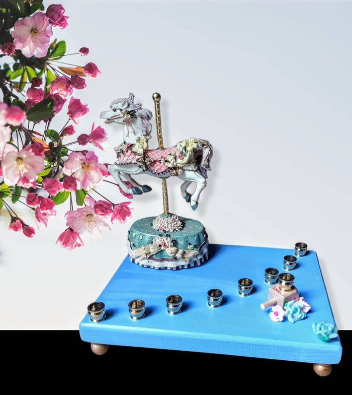 Carousel menorah — vintage musical horse on painted base with silicone flowers | Judaica Square Lakewood