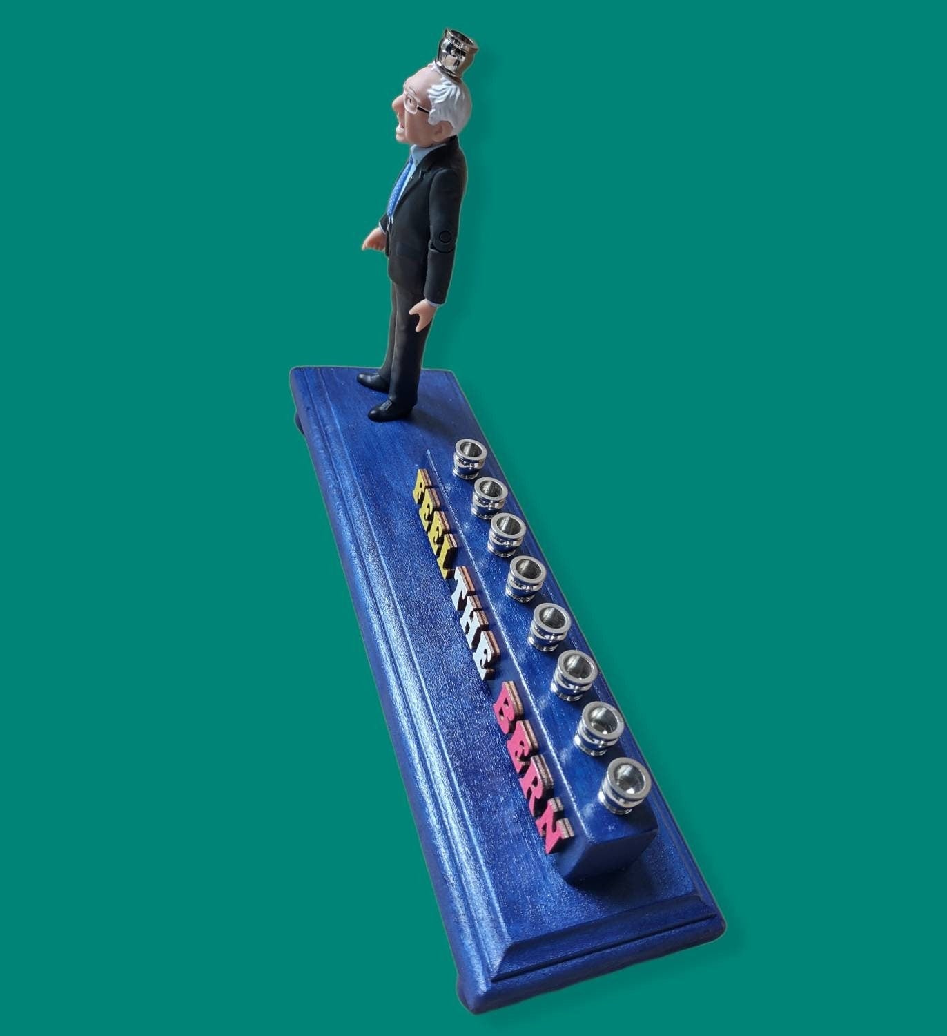 Feel the Bern menorah — Bernie Sanders figure with wood letters and nickel cups | Judaica Square Lakewood (view 4)