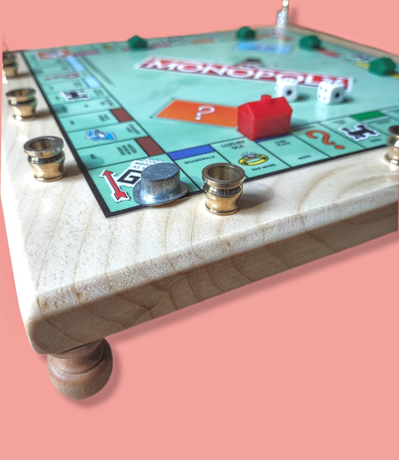 Monopoly menorah — repurposed game board and tokens on stained wood with brass cups | Judaica Square Lakewood (view 5)