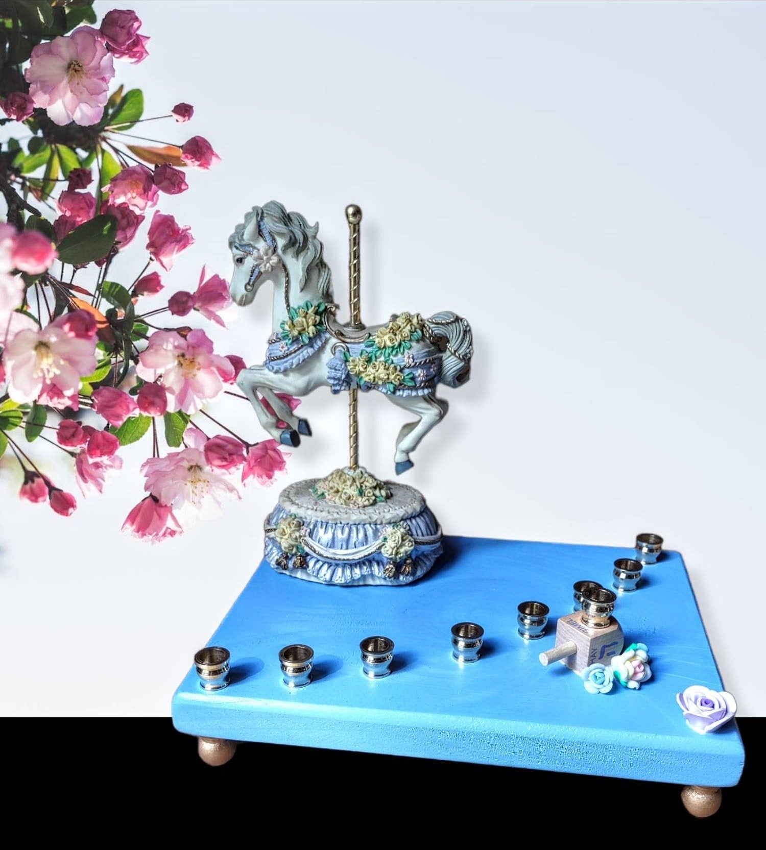 Carousel menorah — vintage musical horse on painted base with silicone flowers | Judaica Square Lakewood (view 3)
