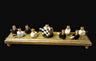 Checkerboard dreidel menorah — black and white checked wood dreidels with gold cups | Judaica Square Lakewood