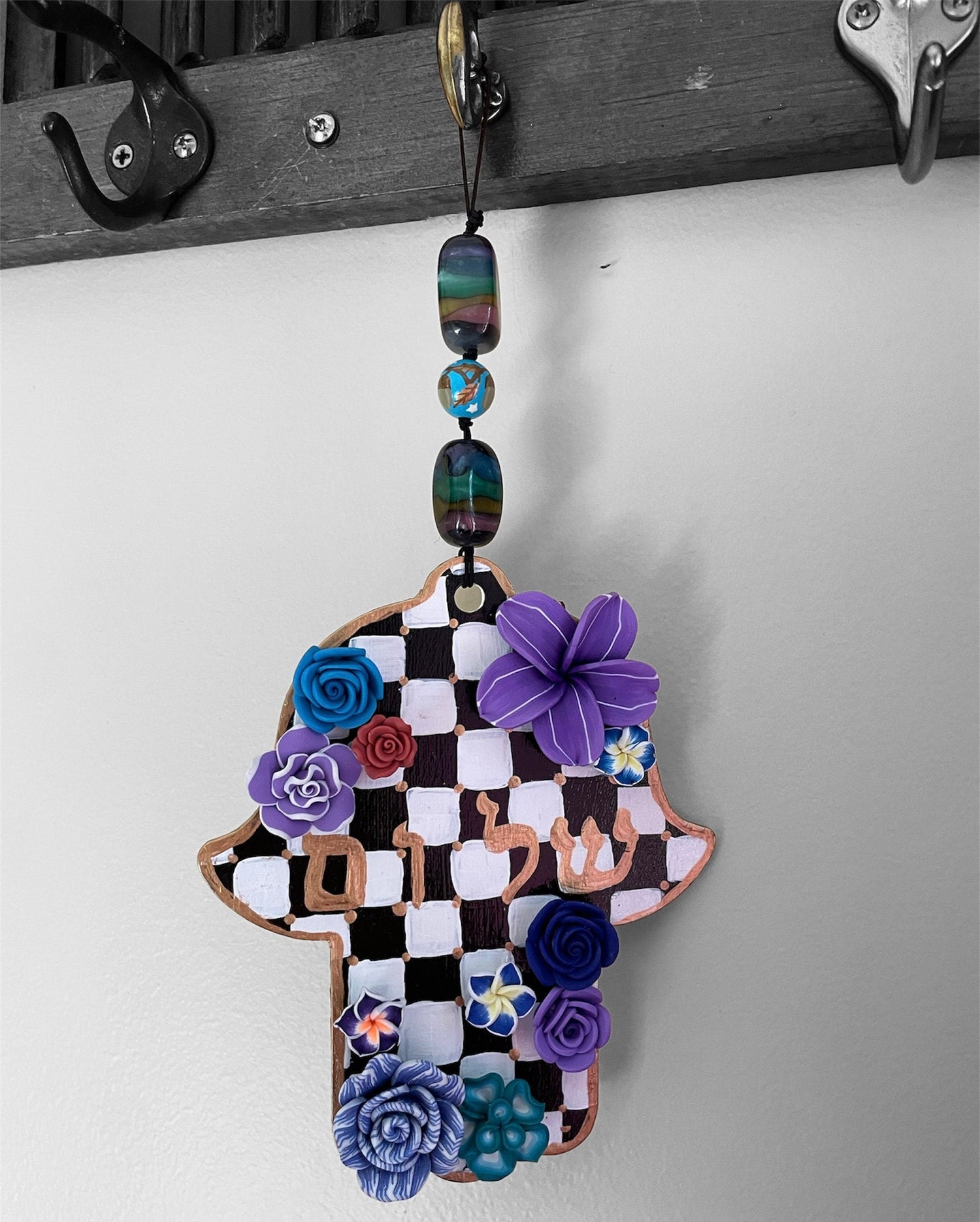 Shalom hamsa — purple and blue checkered wood hanging with flowers | Judaica Square Lakewood (view 3)
