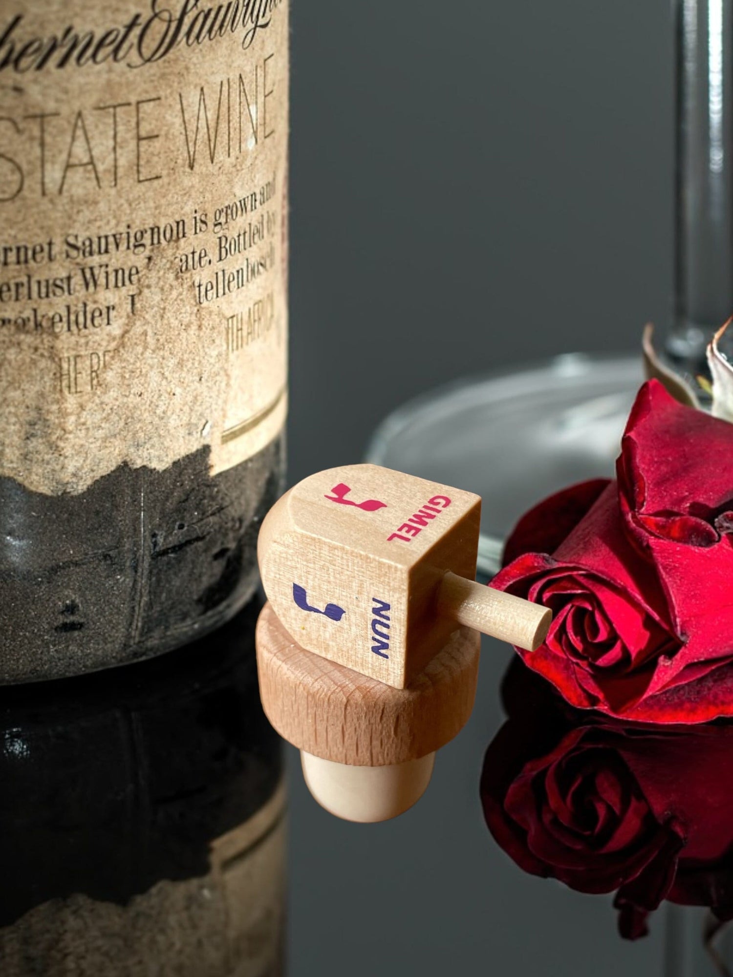 Dreidel Wine Stopper — wooden dreidel on a cork bottle stopper | Judaica Square Lakewood (view 2)