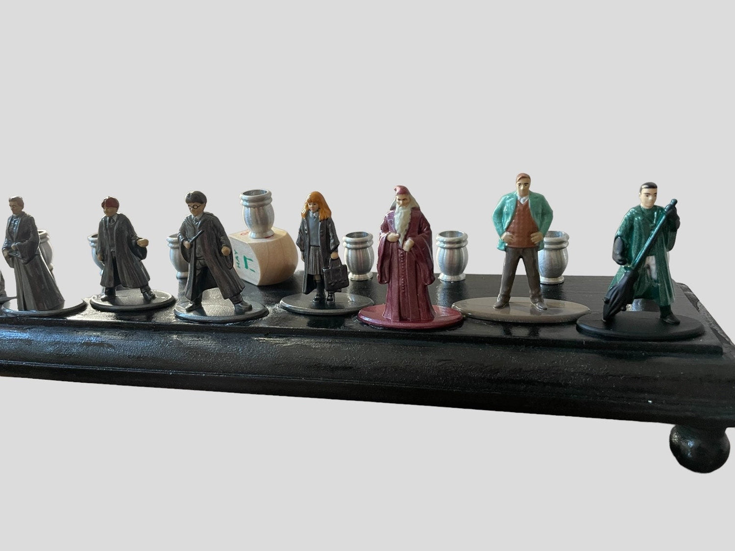 Harry Potter Collector Menorah — nine wizard figures on a long wood plaque | Judaica Square Lakewood (view 5)