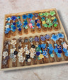 Olive wood mezuzah case with silicone flowers — olive wood base with soft blooms | Judaica Square Lakewood