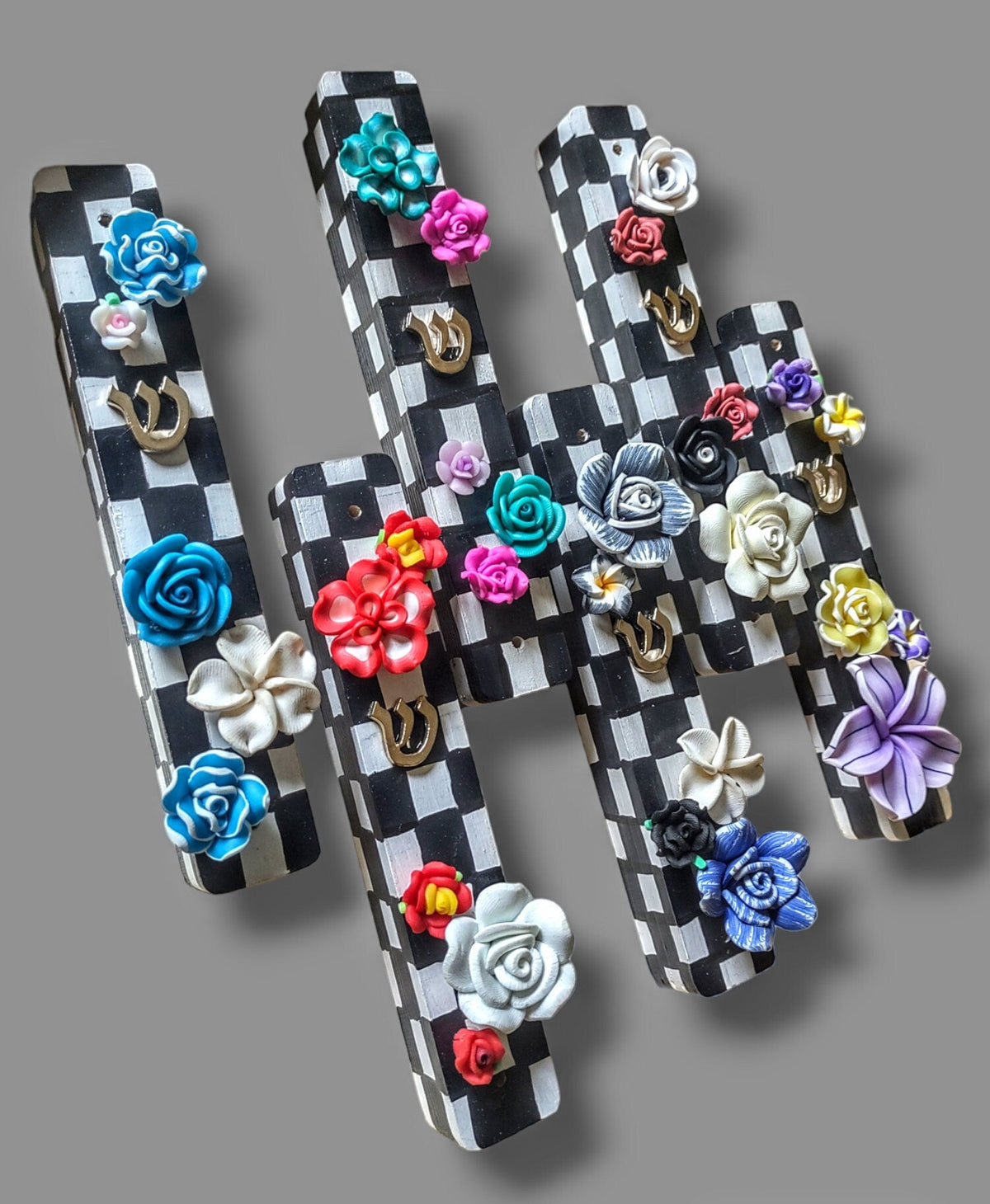 Checkerboard mezuzah case with silicone flowers — painted checks and raised blooms | Judaica Square Lakewood (view 2)