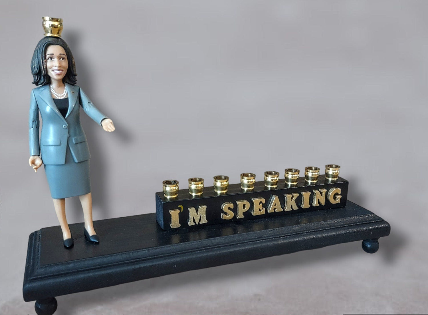 Kamala Harris Menorah — figure beside hand-painted I'm Speaking letters | Judaica Square Lakewood (view 2)