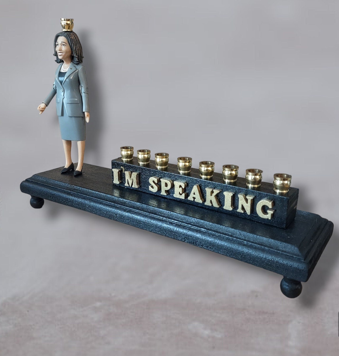 Kamala Harris Menorah — figure beside hand-painted I'm Speaking letters | Judaica Square Lakewood (view 3)