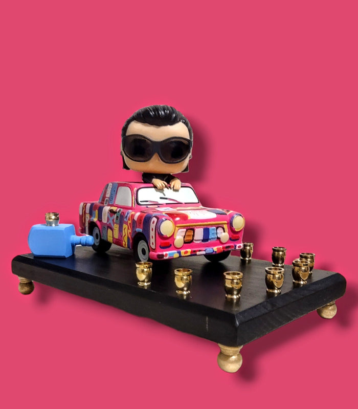 U2 Bono menorah — vinyl Bono figure in the painted Achtung Baby car with brass candle cups | Judaica Square Lakewood