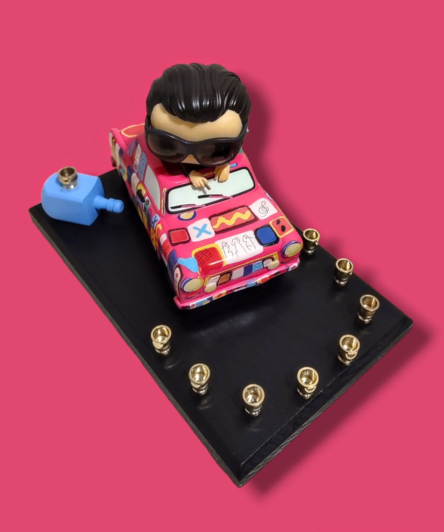 U2 Bono menorah — vinyl Bono figure in the painted Achtung Baby car with brass candle cups | Judaica Square Lakewood (view 4)