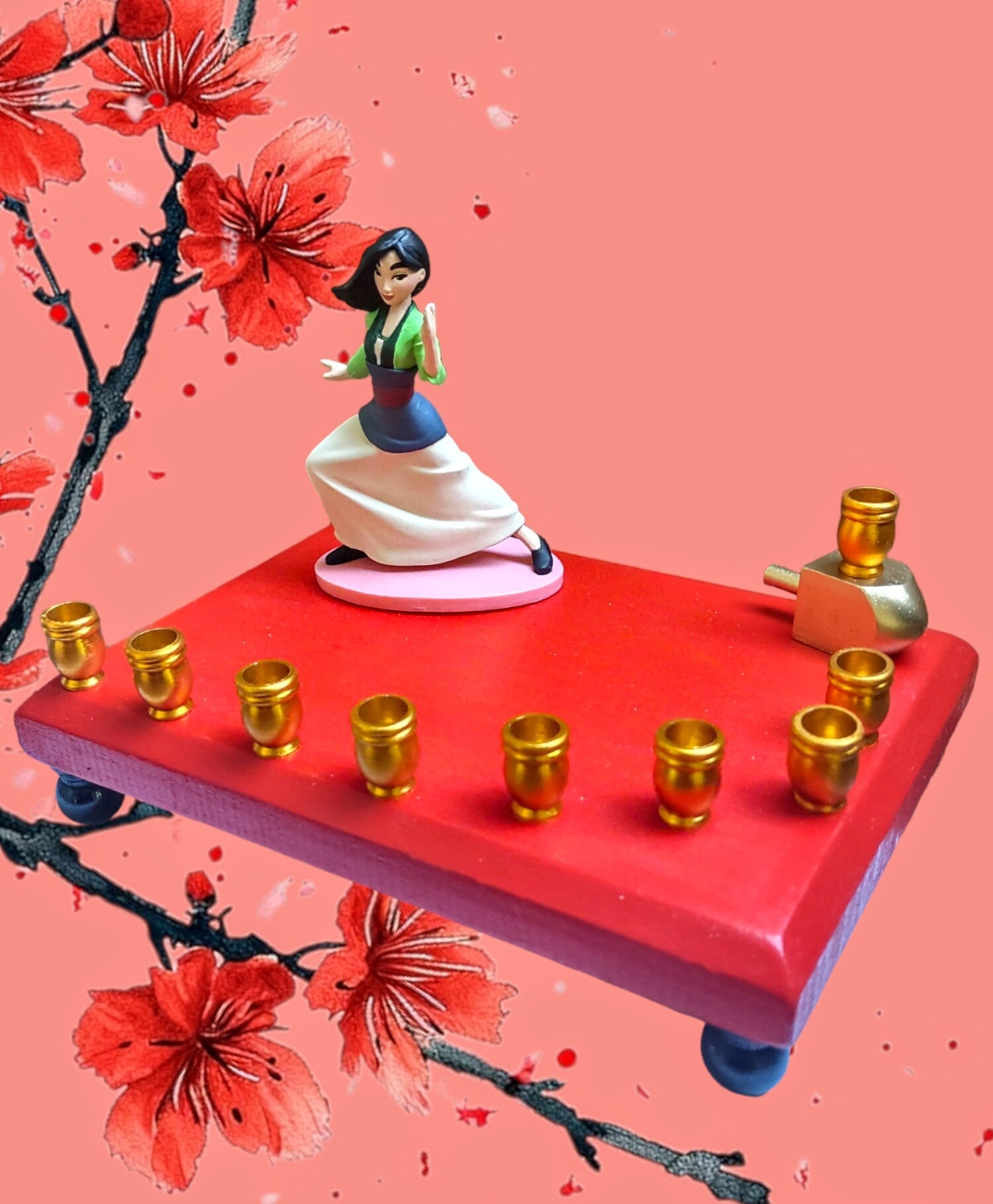 Mulan menorah — repurposed Disney figure on painted rectangular base with dreidel | Judaica Square Lakewood (view 2)