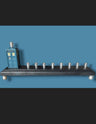 Doctor Who TARDIS menorah — blue police box collectible above brass candle cups | Judaica Square Lakewood