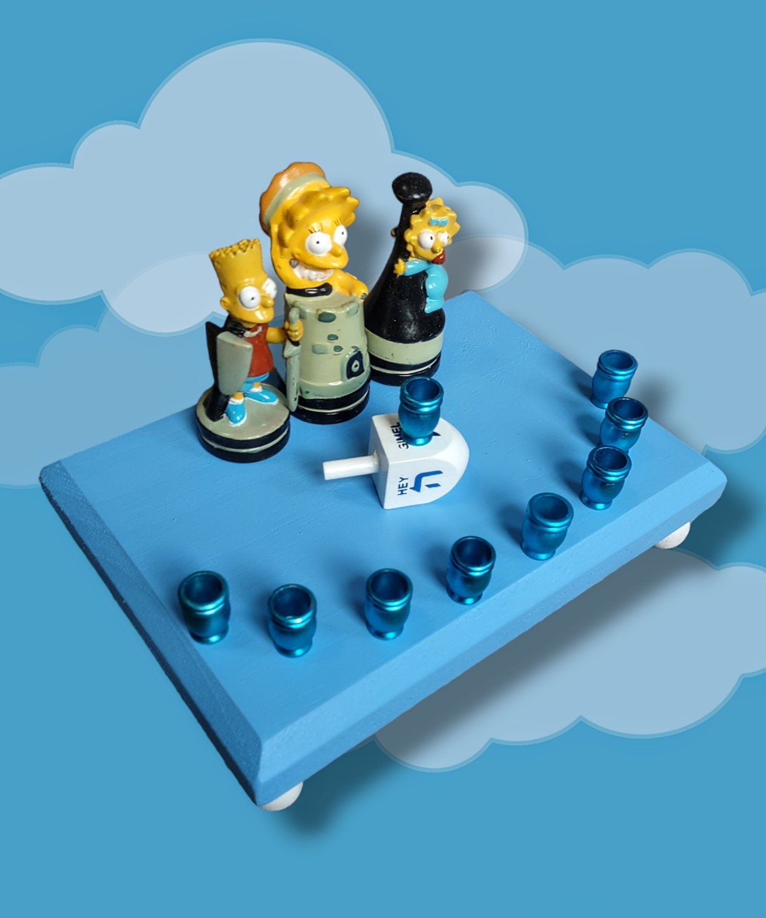 Simpsons kids menorah — Bart, Lisa and Maggie chess figures with blue aluminum cups | Judaica Square Lakewood (view 2)
