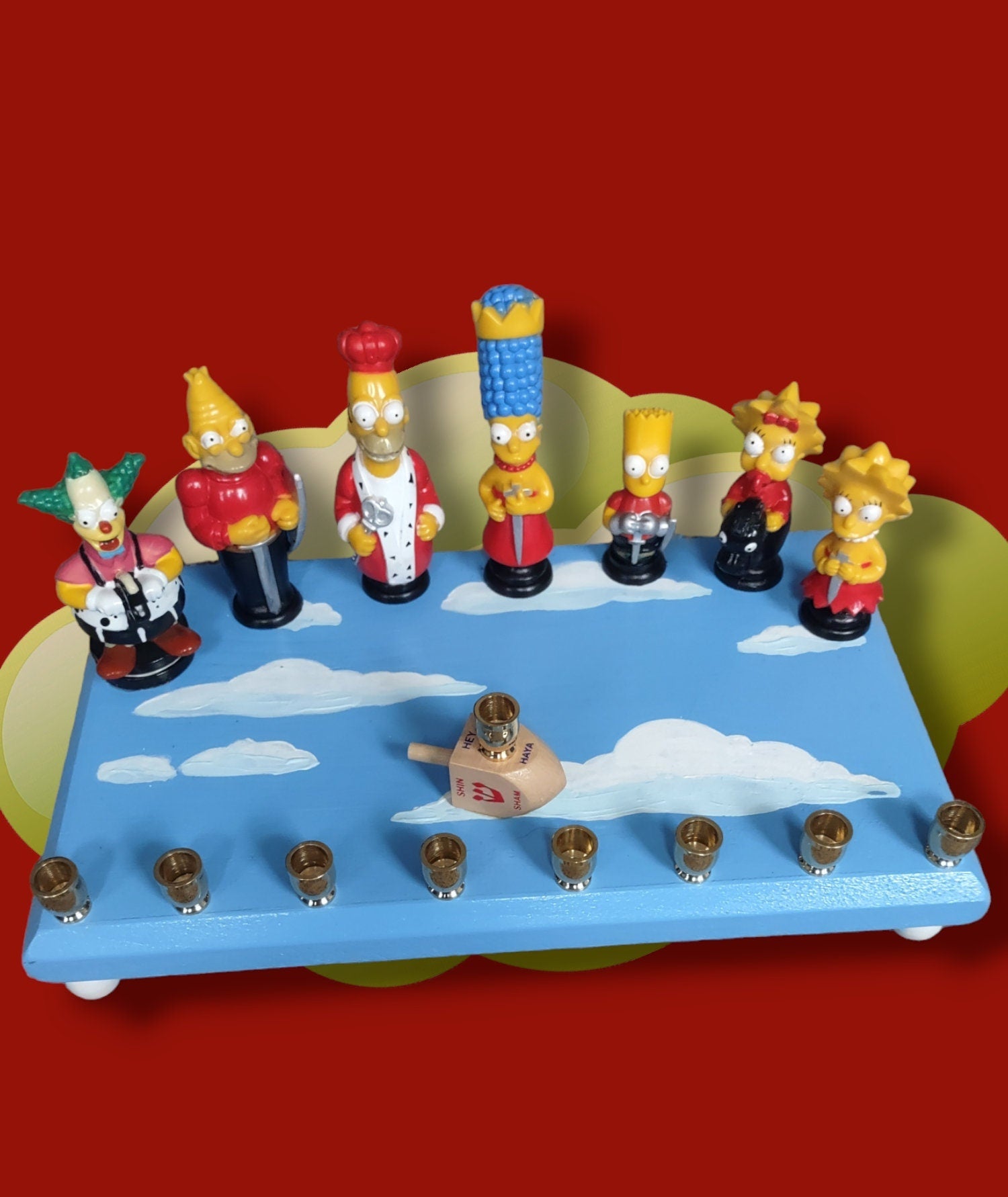 Simpsons Menorah — Homer and family chess figures on a wood plaque | Judaica Square Lakewood (view 2)