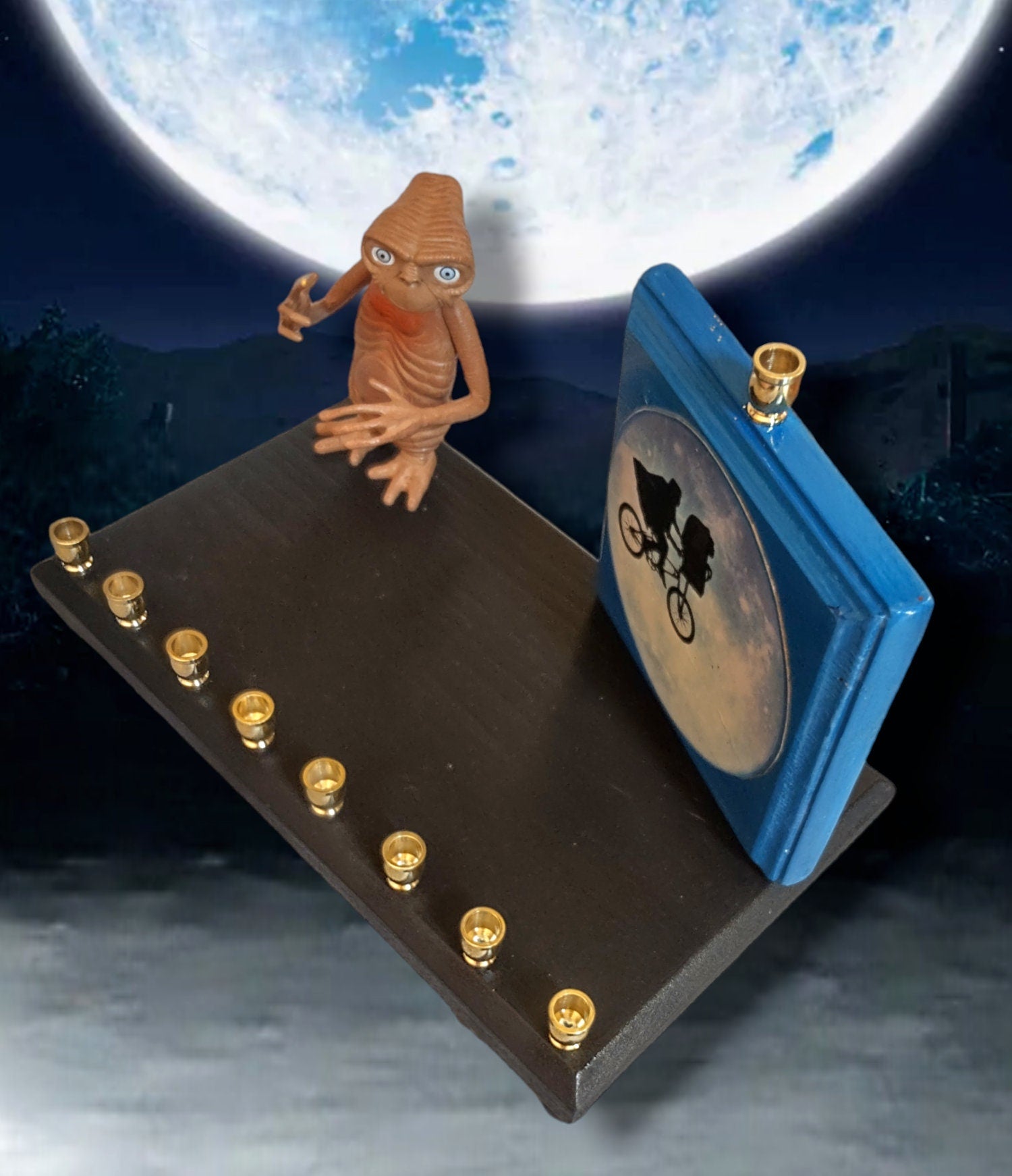 E.T. silhouette collector menorah — figure in front of a painted silhouette plaque | Judaica Square Lakewood (view 4)