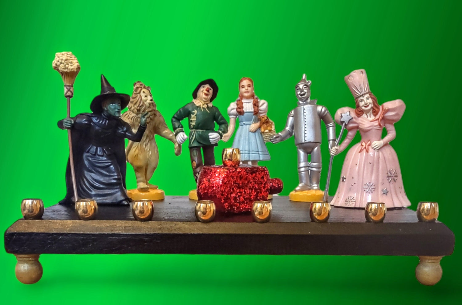 Wizard of Oz menorah — glittered repurposed figures beside a ruby red wood dreidel | Judaica Square Lakewood (view 5)