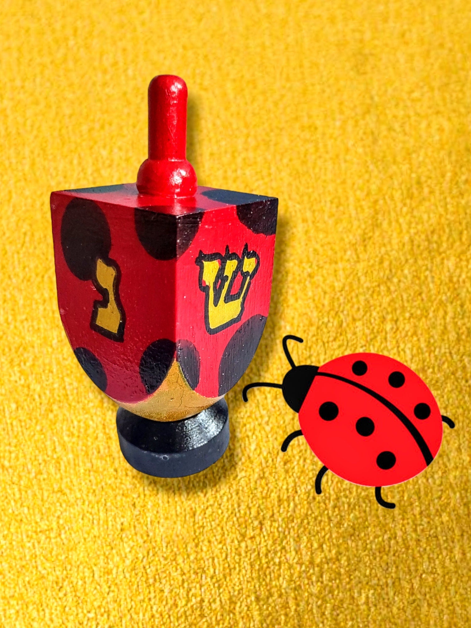 Hand-Painted Ladybug Dreidel — wood dreidel with ladybug art on stand | Judaica Square Lakewood (view 2)