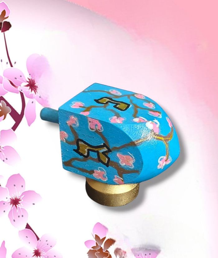 Cherry Blossom Dreidel — pink blossom branches on wood dreidel with stand | Judaica Square Lakewood