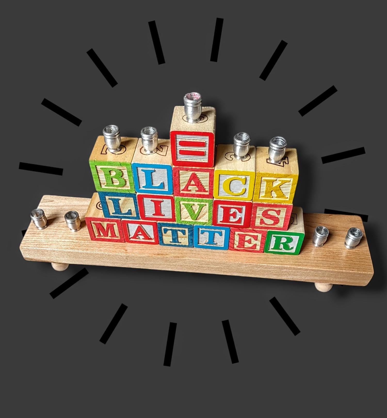 BLM block menorah — wooden letter blocks lined with aluminum candle cups | Judaica Square Lakewood (view 2)