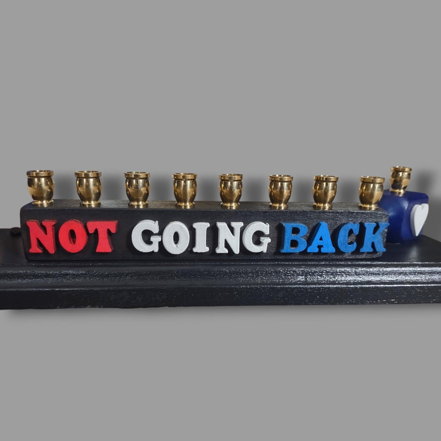 Not Going Back Menorah — Harris figure on painted base with nickel cups | Judaica Square Lakewood (view 4)
