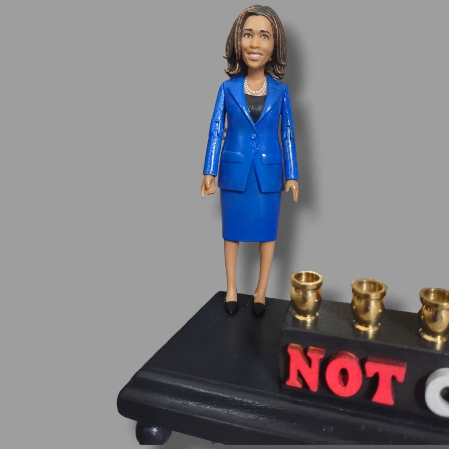 Not Going Back Menorah — Harris figure on painted base with nickel cups | Judaica Square Lakewood (view 5)