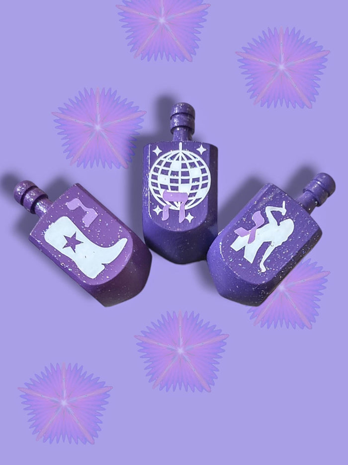 Swiftie Dreidel — purple glitter dreidel with Taylor Swift fan icons | Judaica Square Lakewood