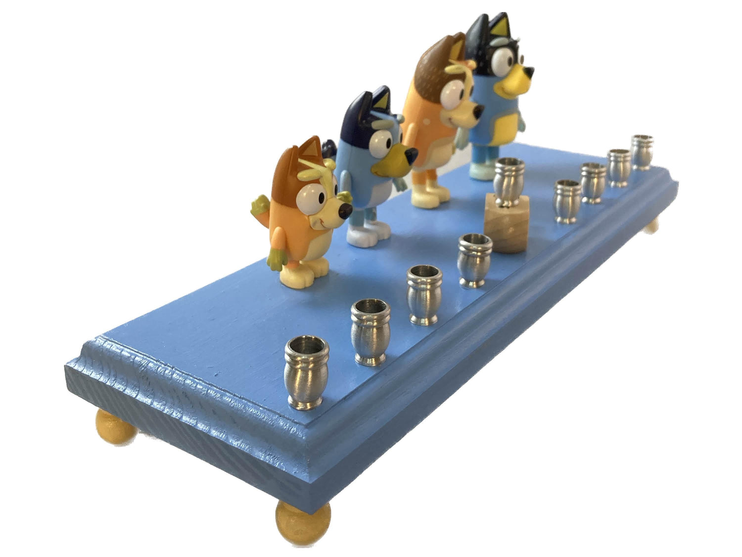 Bluey menorah — blue cartoon dog figures on wood base with brass candle cups | Judaica Square Lakewood (view 3)