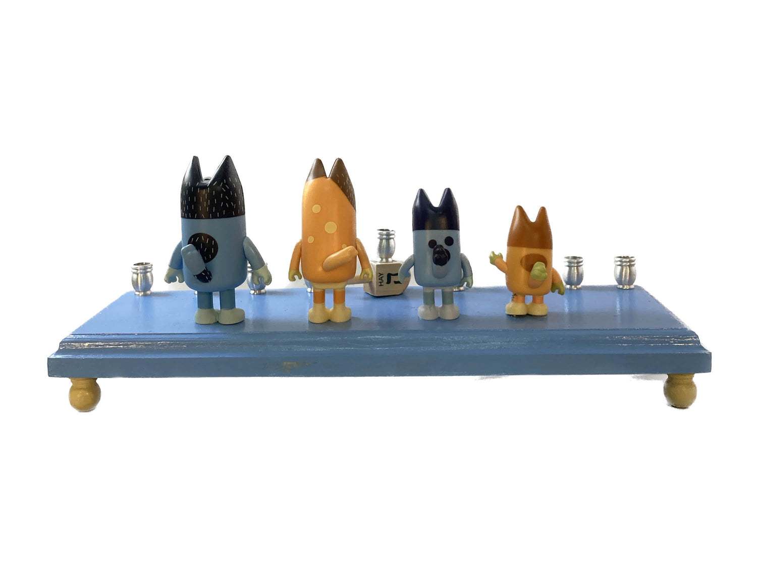 Bluey menorah — blue cartoon dog figures on wood base with brass candle cups | Judaica Square Lakewood (view 5)