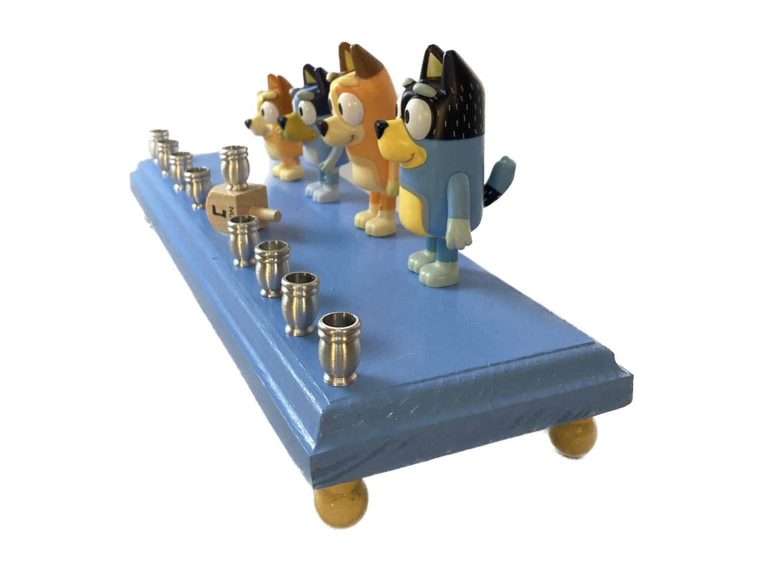 Bluey menorah — blue cartoon dog figures on wood base with brass candle cups | Judaica Square Lakewood (view 2)