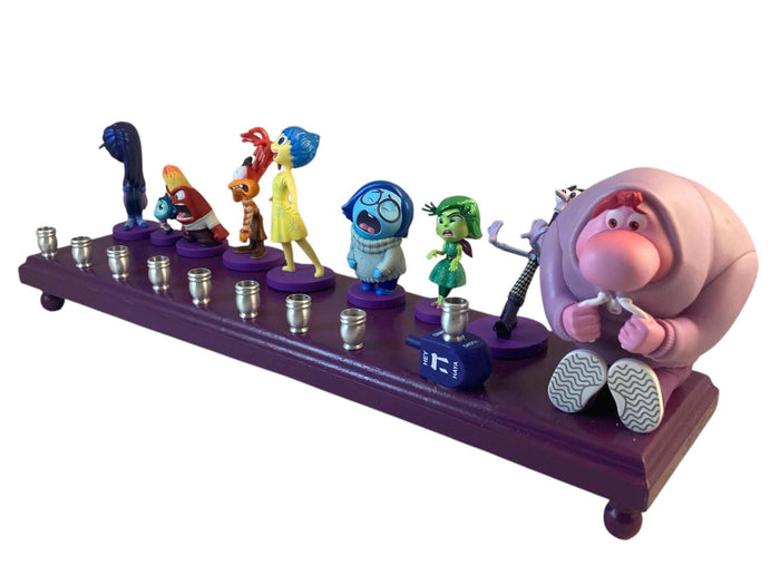 Inside Out 2 Menorah — colorful emotion figures along a long wood plaque | Judaica Square Lakewood