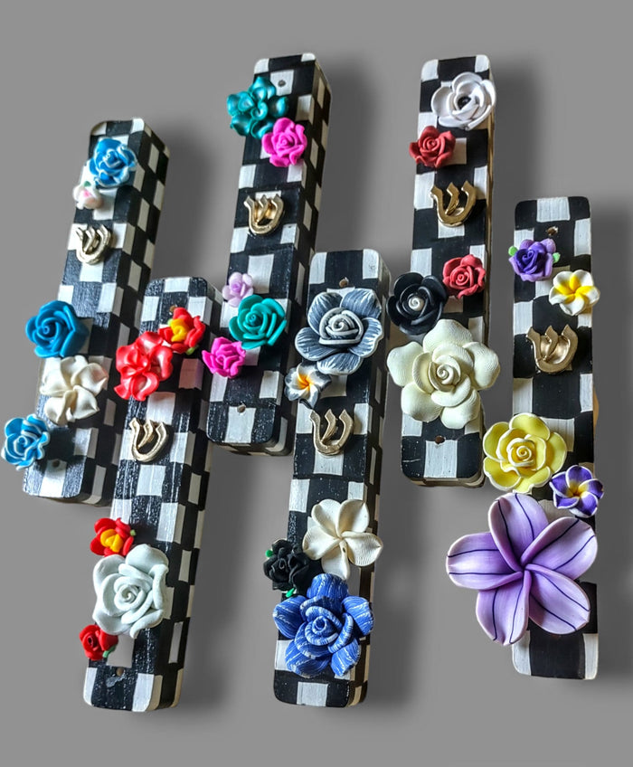 Checkerboard mezuzah case with silicone flowers — painted checks and raised blooms | Judaica Square Lakewood