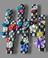 Checkerboard mezuzah case with silicone flowers — painted checks and raised blooms | Judaica Square Lakewood