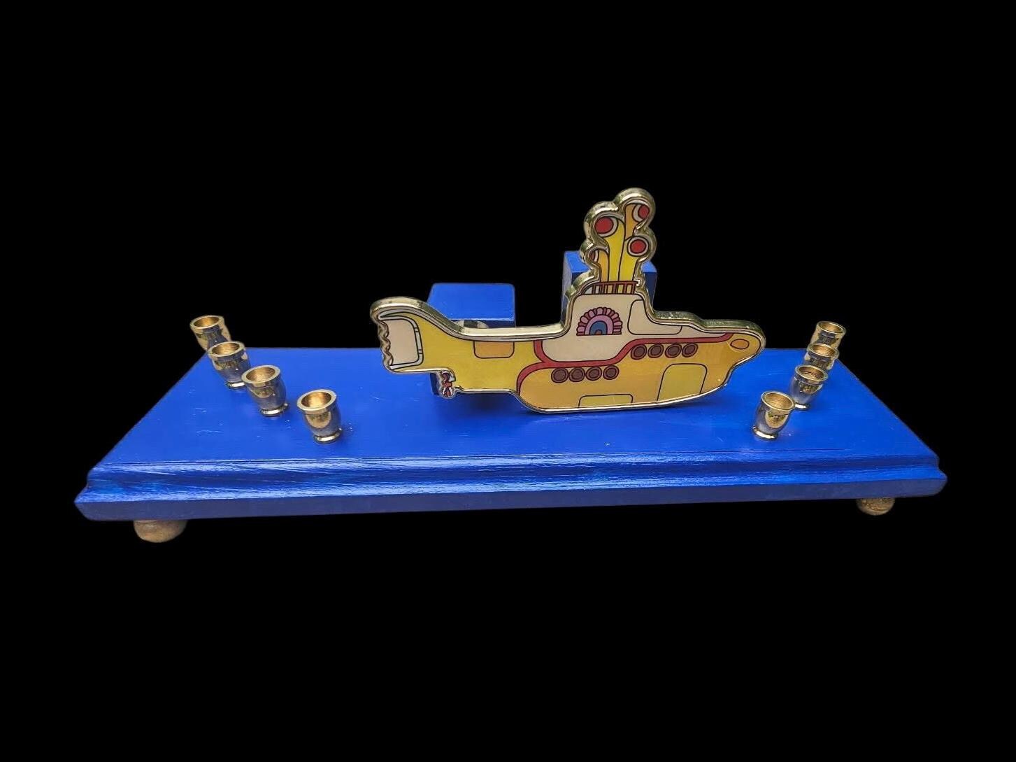 Beatles menorah — yellow submarine bottle opener magnet on painted wood base | Judaica Square Lakewood (view 2)