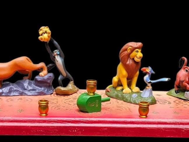 Lion King menorah — Mufasa and cubs on sunset mandala plaque with gold cups | Judaica Square Lakewood