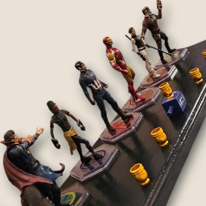 Avengers menorah — Marvel superhero action figures with brass candle cups on wood plaque | Judaica Square Lakewood (view 3)