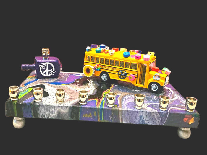 Hippie peace bus menorah — die-cast bus on a swirled acrylic plaque with beads and dreidel | Judaica Square Lakewood